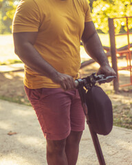 Man riding push scooter.