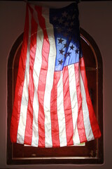 american flag on the window