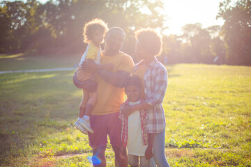Fototapeta premium Portrait of African American family in nature. African American family having fun outdoors.