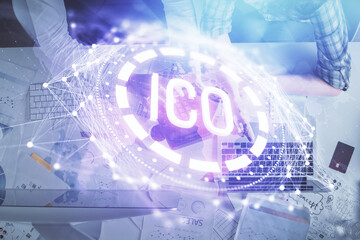 Double exposure of man and woman working together and crypto theme hologram drawing. Computer background. Blockchain concept. Top View.