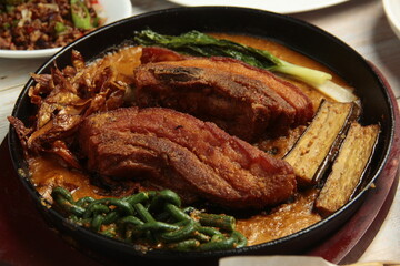 Filipino food called Kare Kare or meat and vegetables cooked in savory thick peanut sauce