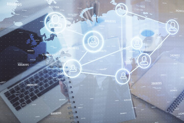 Double exposure of woman hands typing on computer and social network theme hologram drawing. People media concept.