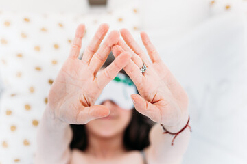 Girl in bed woke up, sleep, morning, morning procedures, Breakfast, pillow, sleep mask, hands