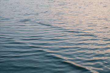 Calm sea wave under amazing sunset. Inspirational nature landscape, beautiful colors, wonderful scenery of tropical beach. Beach sunset, summer vacation
