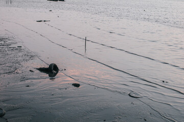 Calm sea wave under amazing sunset. Inspirational nature landscape, beautiful colors, wonderful scenery of tropical beach. Beach sunset, summer vacation