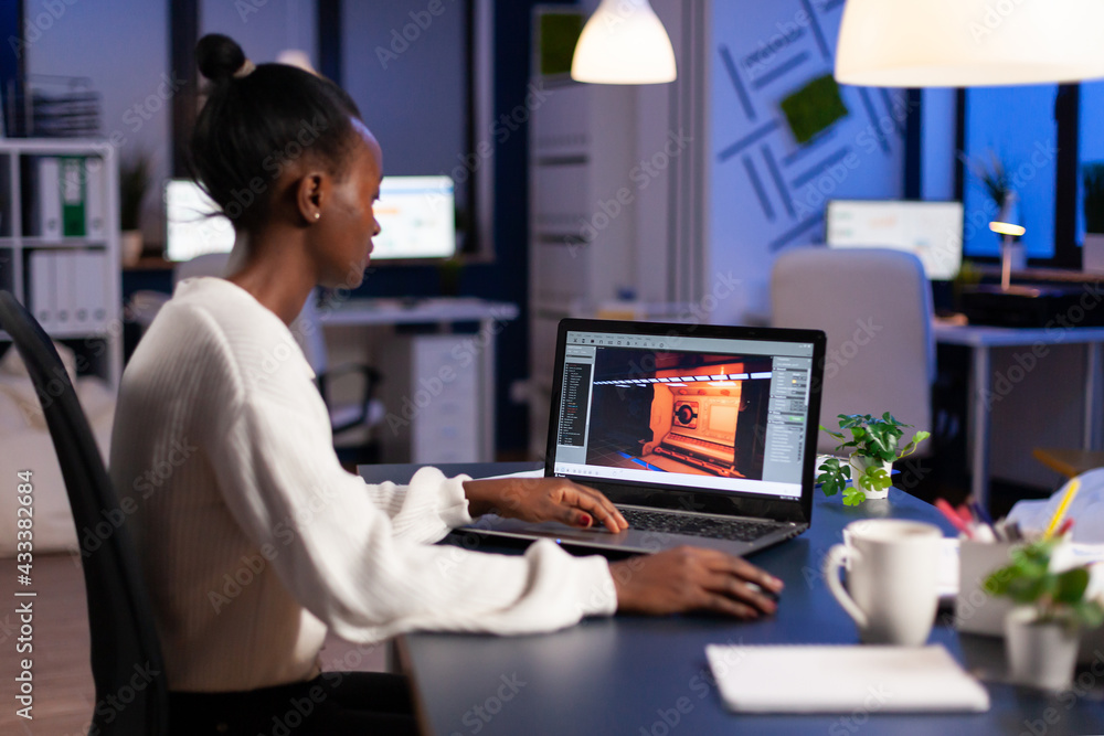 Aufkleber dark skin gamer developer working at video game in midnight from business office using professional 