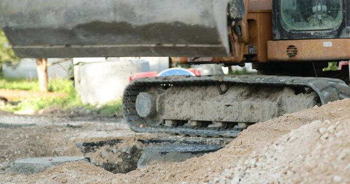 Heavy-Duty Vehicle Fills The Hole With Brown Soil In Road Construction In Leiria, Portugal close up