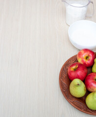 Ingredients for cooking autumn baking. Flour, eggs, sugar, pears and spices. White background.
