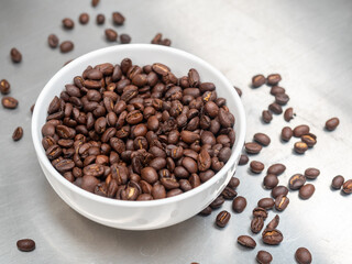 Roasted coffee beans on stainless steel top table