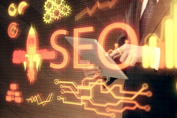 Multi exposure of man's hands holding and using a digital device and seo drawing. search...