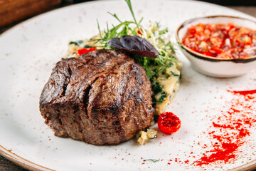 Closeup on grilled fillet mignon steak with salad