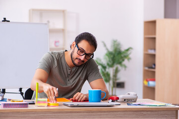Young male designer working in the office