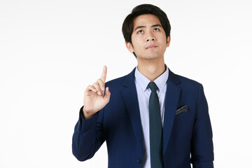 Male manager stand up, pointing his finger upwards with a serious expression. Seems like he want to find a solution for his problem. White background help feeling of photo not too heavy.