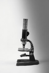Old microscope for inspection and analysis of defects.Microscope, is an optical device for...
