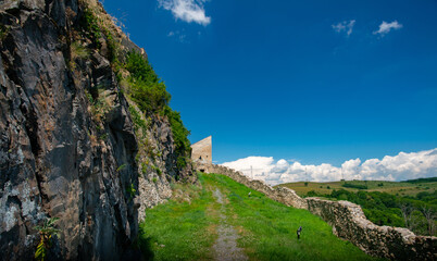 green trees and blue sky in a beautiful visit to the ancient stone fortress - 433395457
