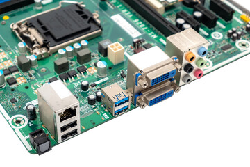 Assorted connectors on a computer mainboard detail in an e-waste pile