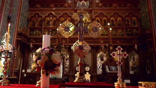 A closeup view of an altar background with crosses and candles in HD