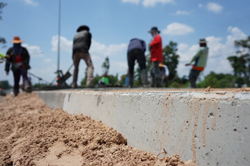 Blurred image of concrete pouring By manual labor