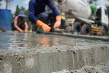 Blurred image of concrete pouring By manual labor