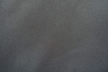 Surface of simple dark gray viscose and polyester fabric from above