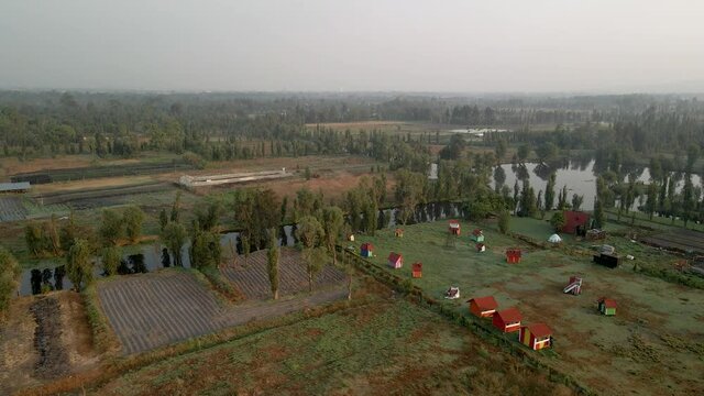 Rotational view of ancient like of xochimilco and trajineras