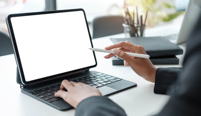 Close Up . Hands of woman designer using digital tablet to work at home or in the office.