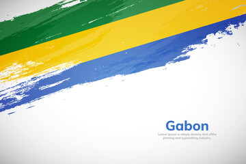 Brush painted grunge flag of Gabon country. Hand drawn flag style of Gabon. Creative brush stroke concept background