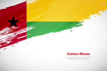 Brush painted grunge flag of Guinea-Bissau country. Hand drawn flag style of Guinea-Bissau. Creative brush stroke concept background