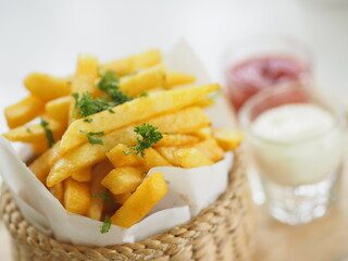 French fries, Potato chips Yellow crispy fries in wooden basket, snack delicious