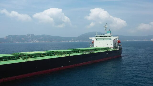 4k 24fps shot on a bulk carrier ship at anchor.