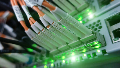 Obraz na płótnie Canvas Close up fiber optic and hub telecommunication in server room. 