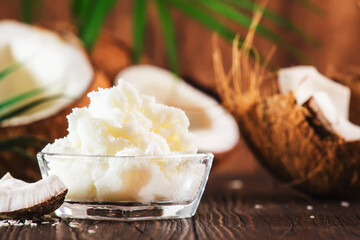 MCT Coconut butter or oil. Organic healthy food, beauty and SPA product. Wooden background. Copy space