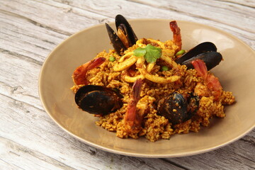 Seafood Paella or Spanish rice dish with seafood and vegetables