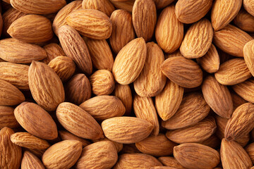 Almonds. Almond background. Almonds top view background. Whole nuts flat lay. Full depth of field.