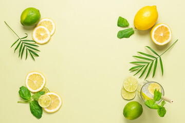 Summer pastel green citrus background. Slices of lemon lime and mint. Top view, copy space