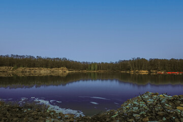 Fototapeta na wymiar forest lake on a warm evening