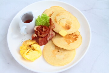 Pancakes with bacon and egg