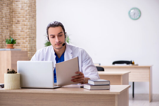 Young male doctor in telemedicine concept