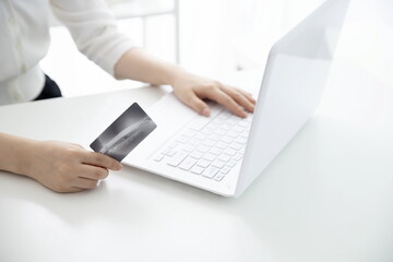Fototapeta premium Woman shopping online with credit card