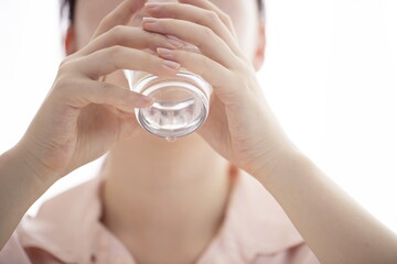 Close up of woman drinking glass of water