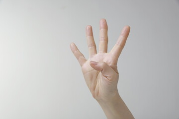 Woman showing four fingers gesture 