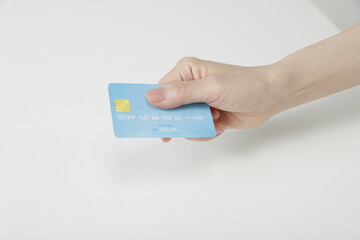 Close up of woman holding credit card