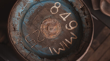 old blue drink barrel covered in dust