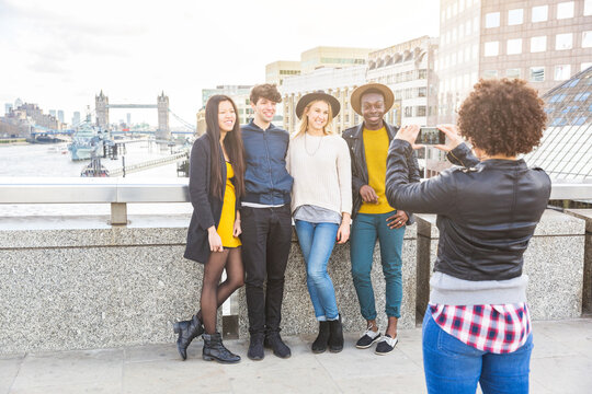 Group of friends taking a photo together in London