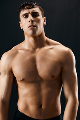 Fototapeta na wymiar sexy man with pumped up abs bodybuilder workout model