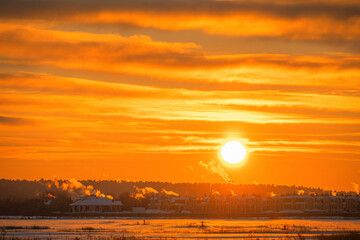 Sunset over the winter village 