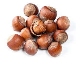 pile of shelled and unshelled hazelnuts closeup