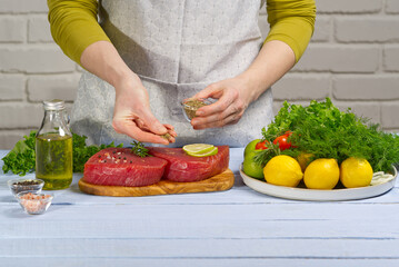 Cooking tuna steak. Fresh Atlantic bluefin tuna steak, with spices and ready for fry. The yellowfin tuna raw fresh medallion. close-up.