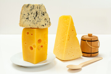 Fourme d'Ambert and cheese hit fitness on white background