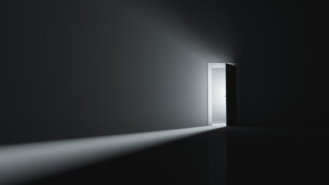 A slightly open door to a room with bright light. Copy space.